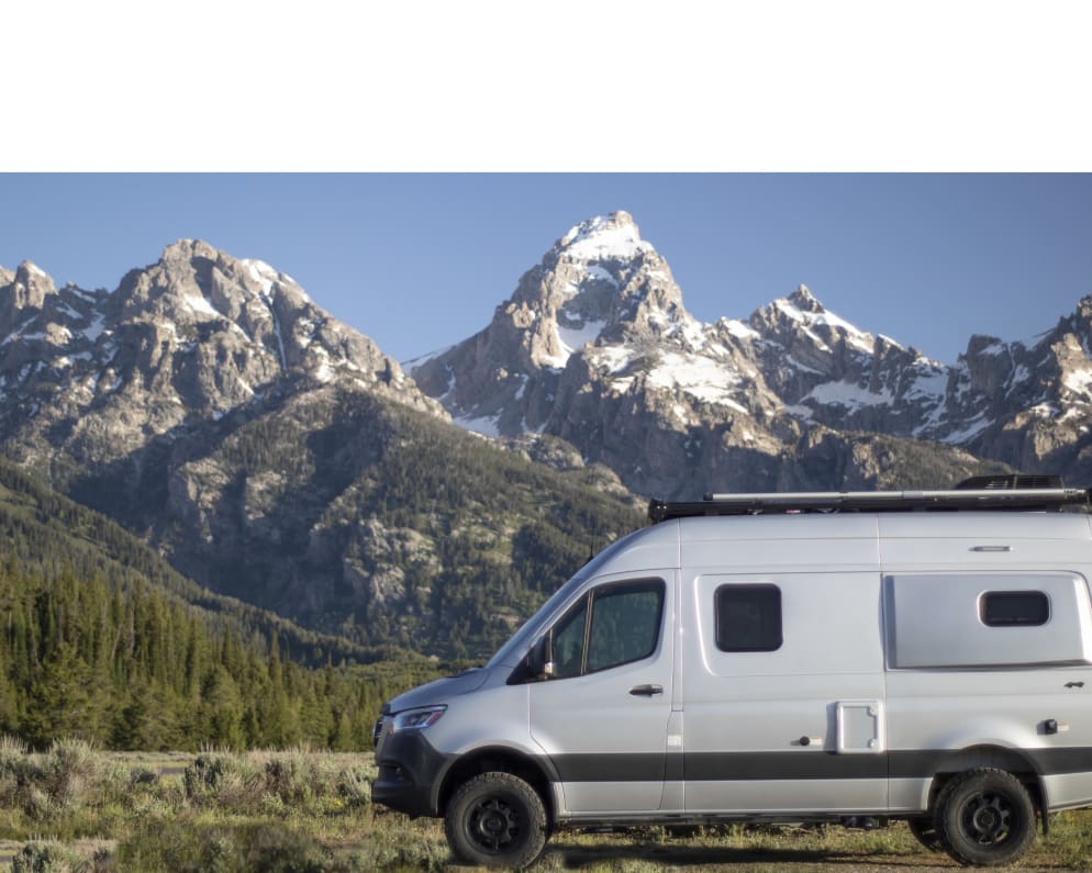 Premium RV for overland adventures. 2020 winnebago Revel with custom rear lounge, gear storage, bike rack and camping accessories.