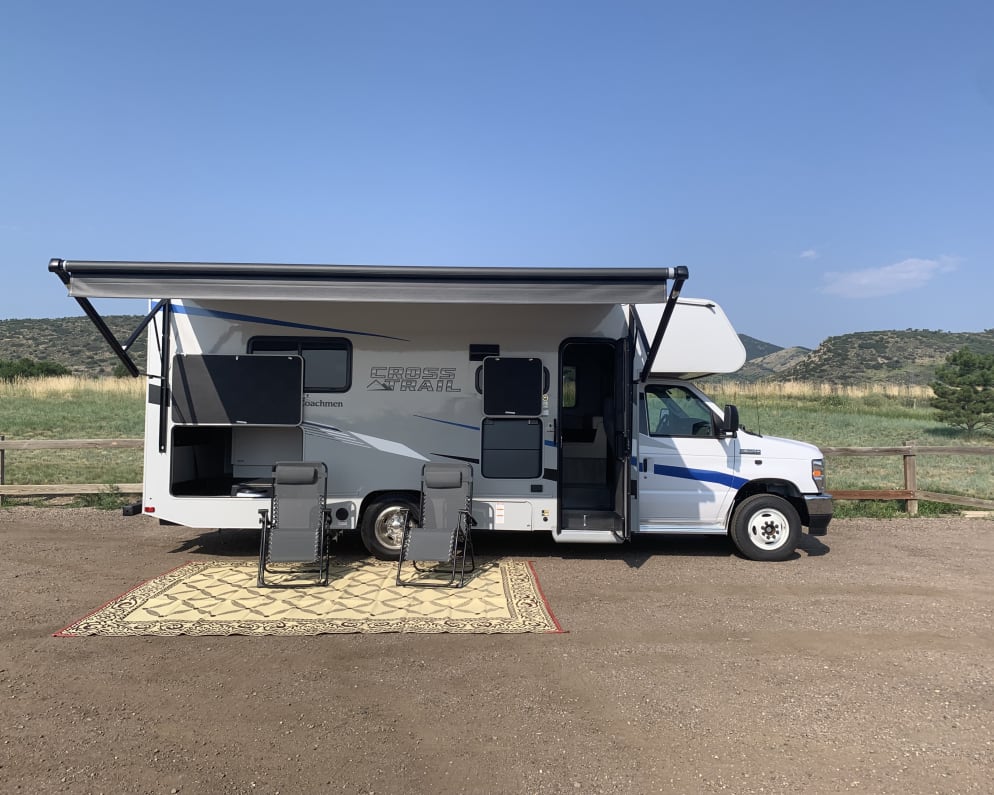 Powered awning allows you to take a break from the sun. Outdoor rug is included with rental. 