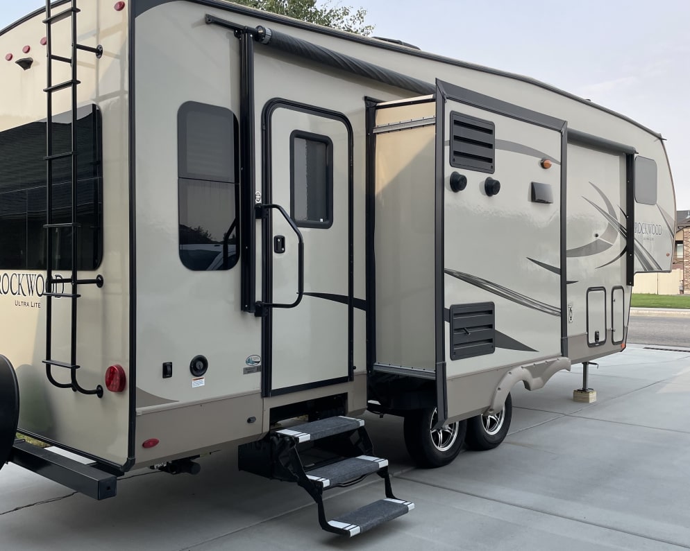 An awning covers this entire area, making it a great place to add your chairs, grill and play games!