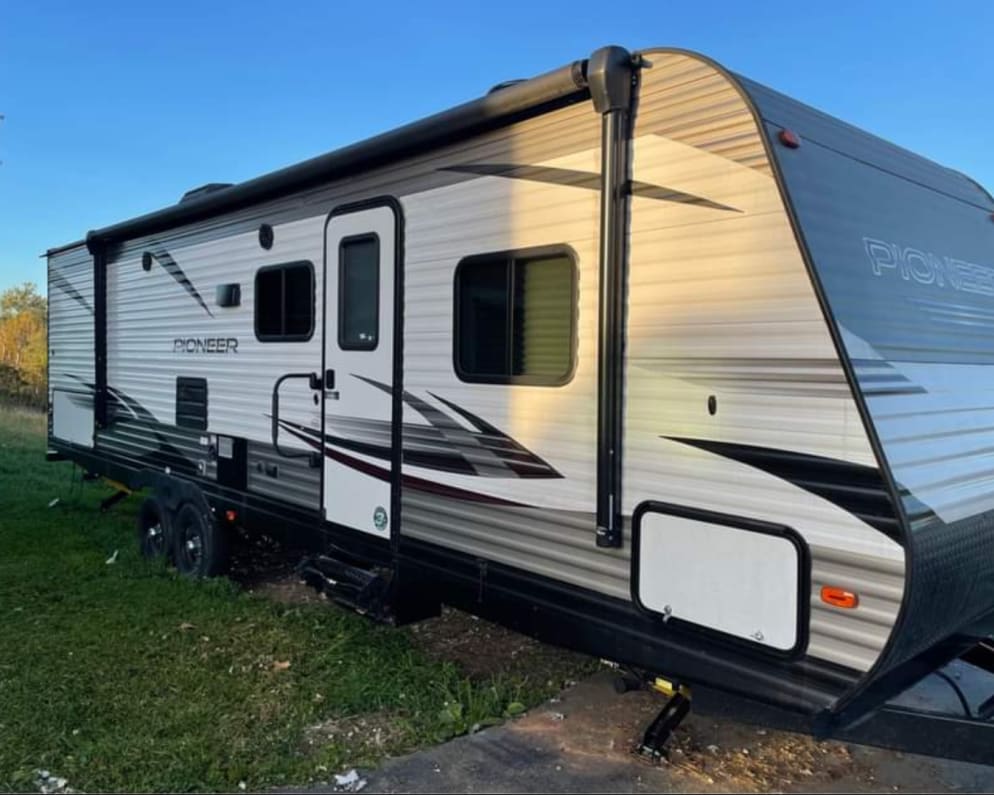 Large 20-foot Power Awning for plenty of shade or shelter!! 
Outdoor kitchen at the back with stovetop, fridge, and sink!