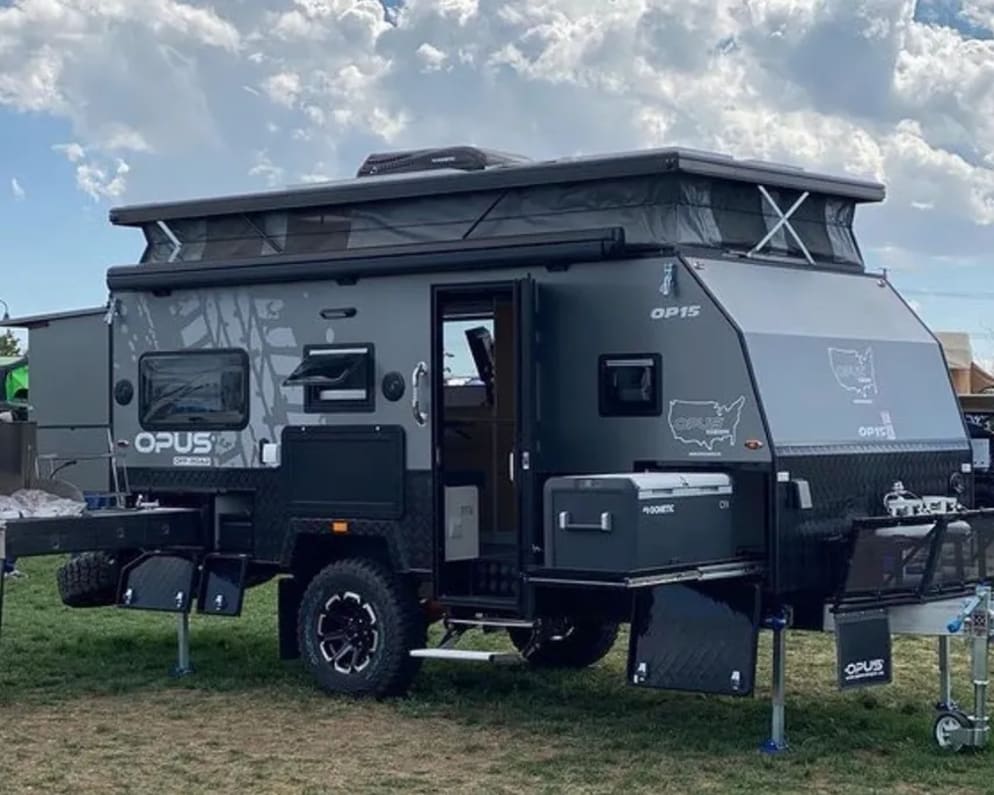 This is a stock photo from Opus of the Caravan set up in camp mode.  This is a &quot;hybrid&quot; trailer where the top and back pop up for more space inside.