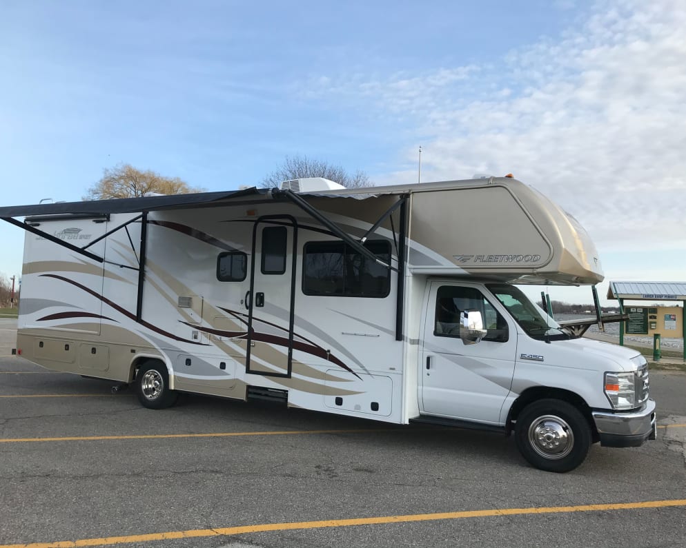 Passenger side with motorized patio awning open