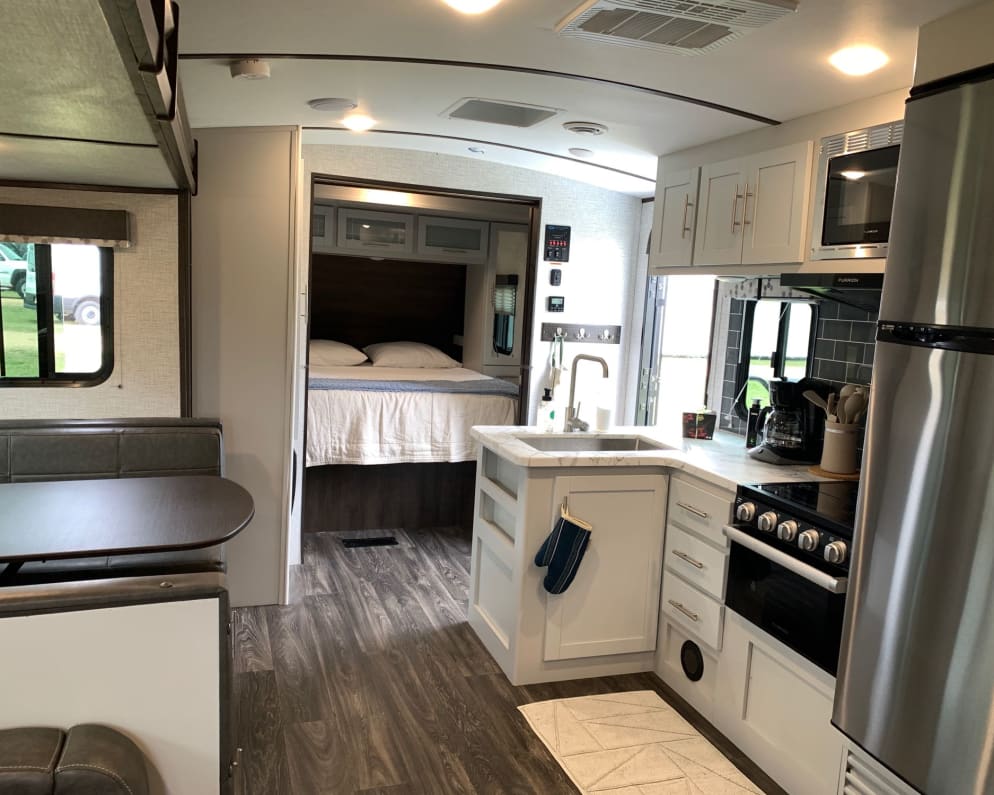 beautiful open floor plan with center sliding door to main bedroom