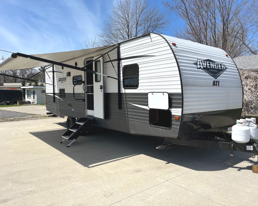 Outside view with Power Awning extended. 