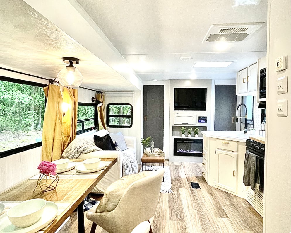 Dining, living, and kitchen area with sliding doors to the master bedroom. 