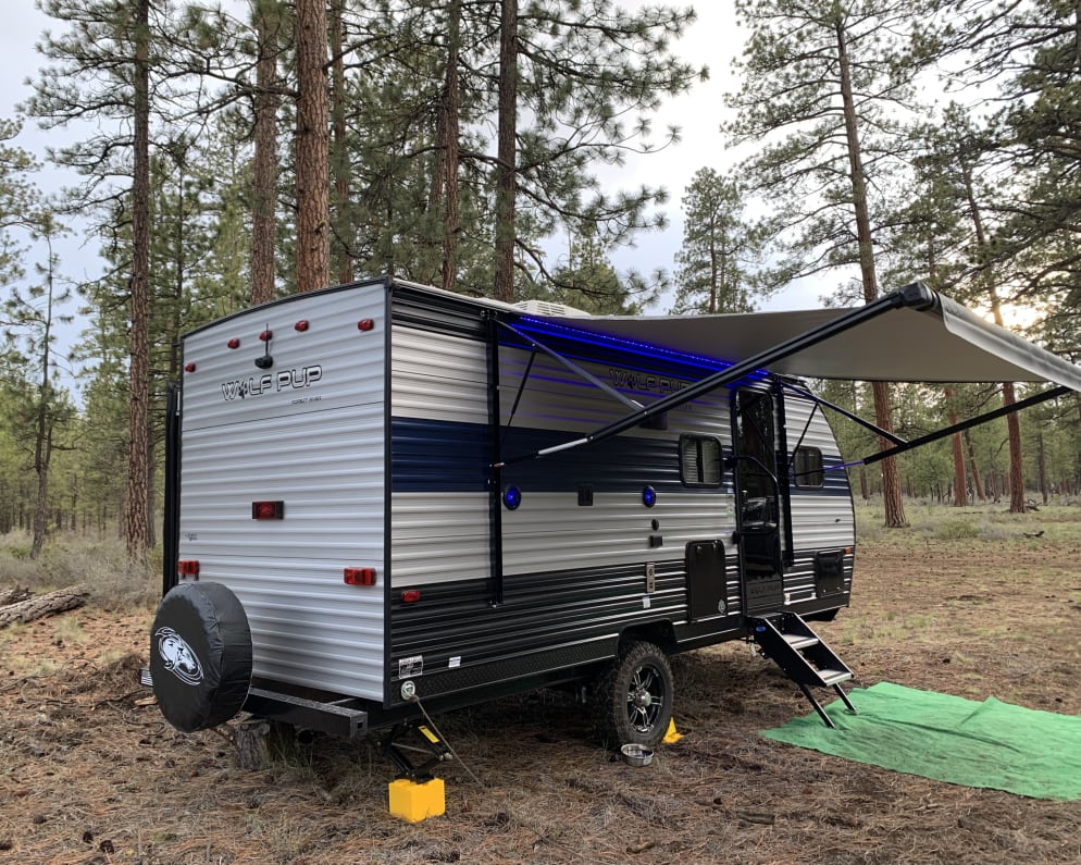 RH side with entry door and awning extended.