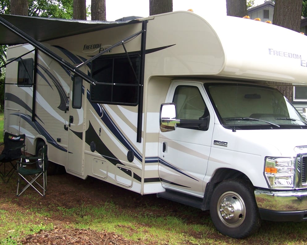 Passenger side has under awning lights and a power awning