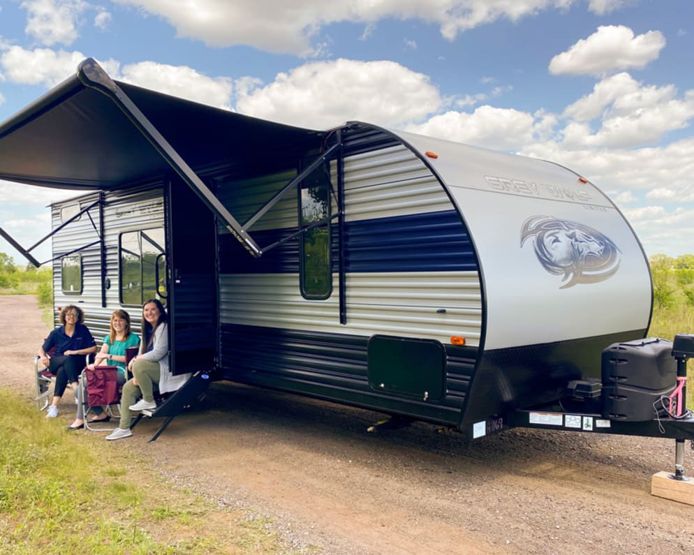 Exterior image of 2022 Forest River Grey Wolf travel trailer with awning