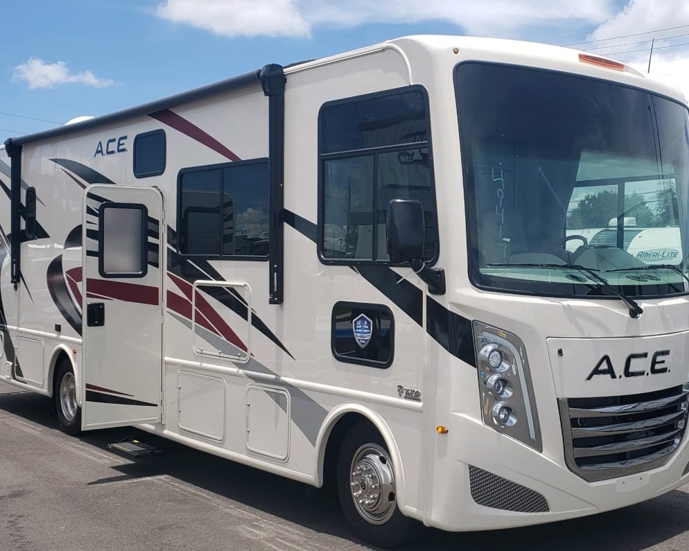 View of front and passenger side of the unit with the entry door open. 