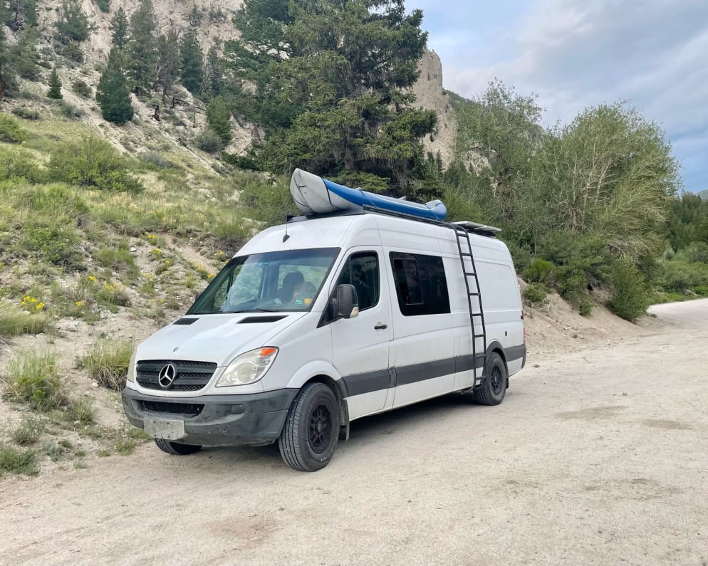 On an adventure near Buena Vista, Colorado. The top of the van has a large roof rack to fit extra toys!
