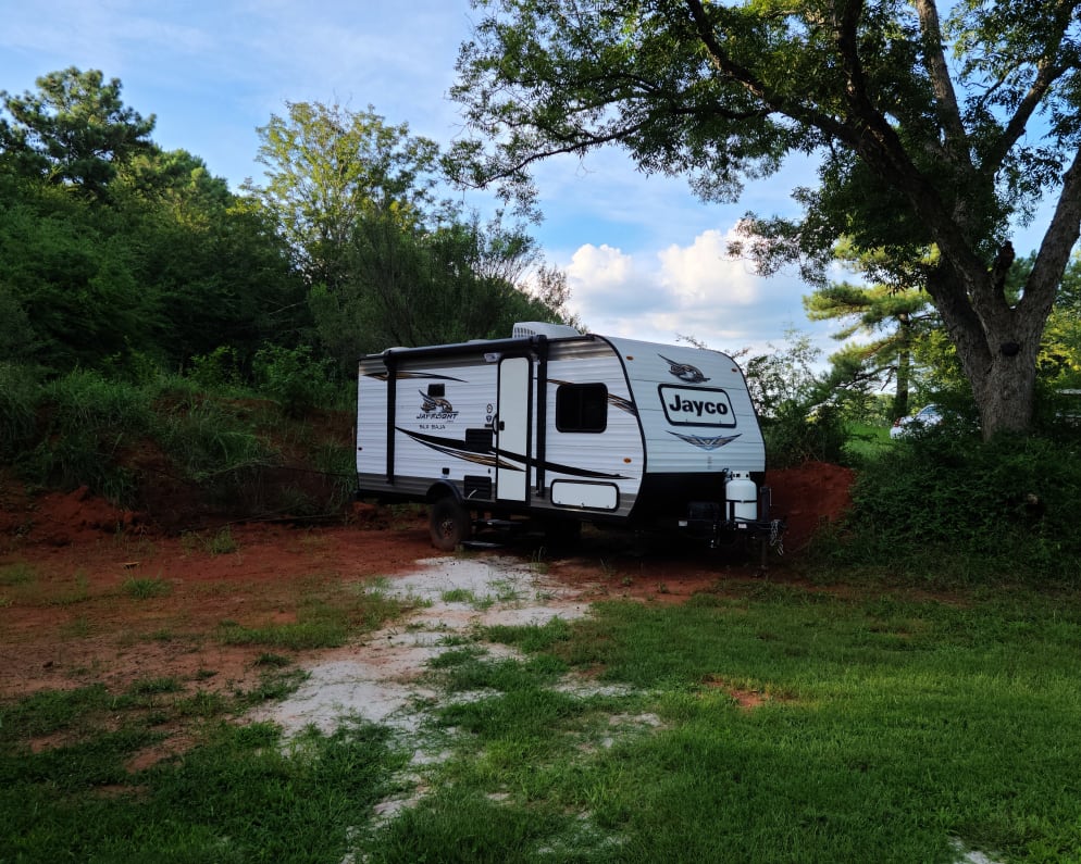 Front side of my Jayco Jay Flight Baja Edition! Front door and steps also propane tank