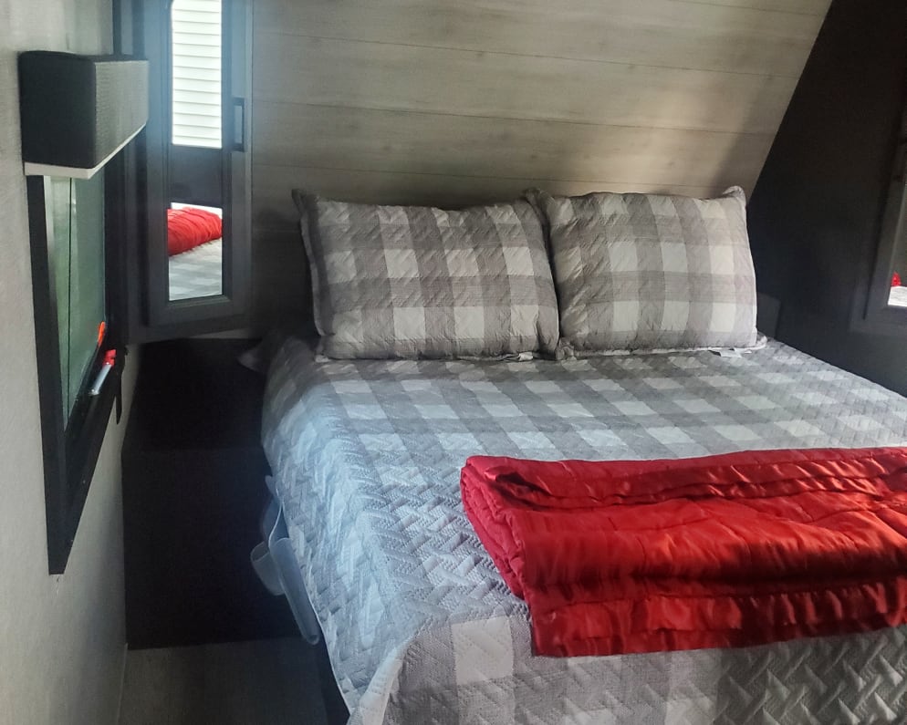 Main bedroom that offers an outside door for easy entry. A door to for privacy from the rest of camper.  