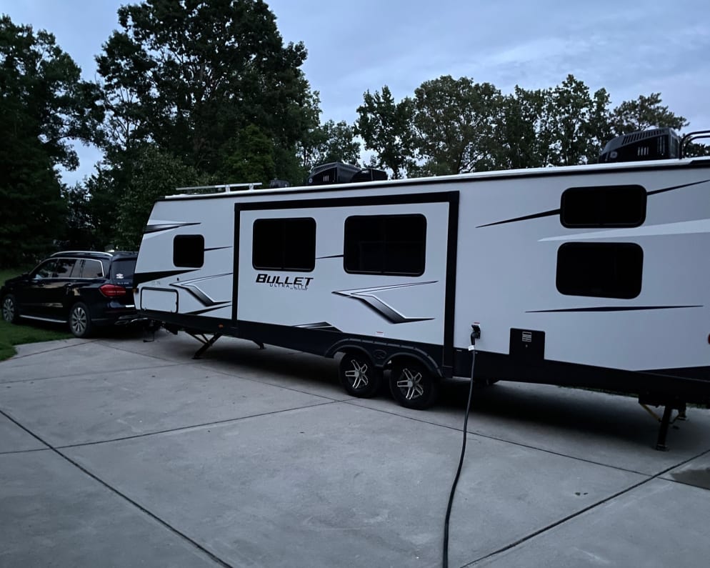 Like new 2022 Keystone Bullet, 33’ with separate master bedroom, living area and back bunkhouse.