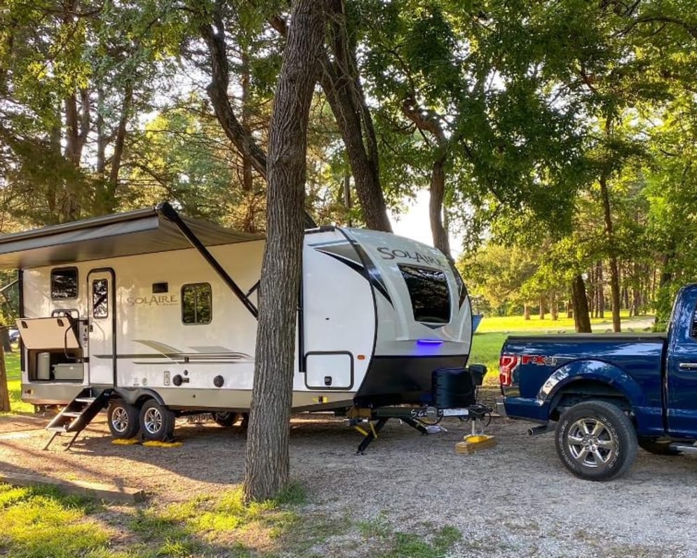 Camper set up at a camp site.