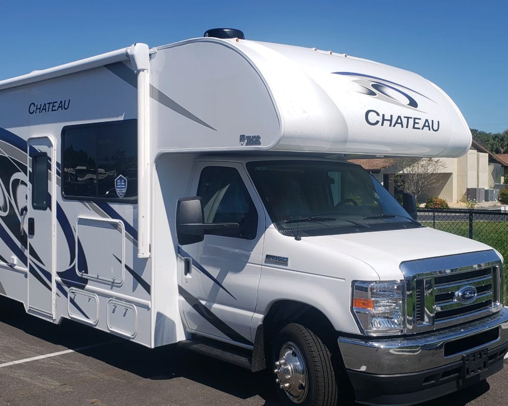 Side view of the Chateau 28Z showing the large awning and exterior compartments. 
