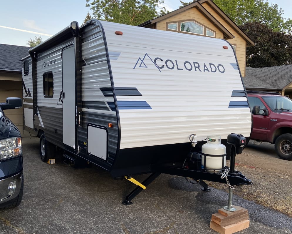 Power stabilizers exterior kitchen (2 gas burners pull out of rear cubby) with mini fridge and storage . 