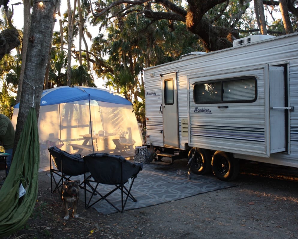 Two club chairs, outdoor rug and hammocks included.