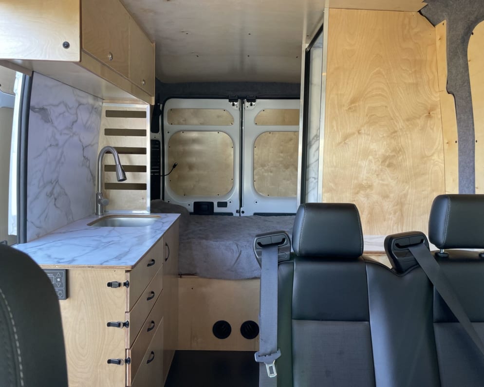 This ProMaster seats 4, sleeps 4, and has a full interior shower.