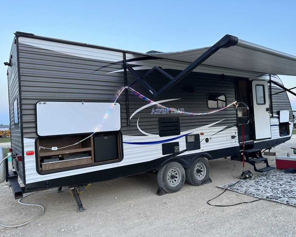 Outdoor kitchen, awning and outdoor mat