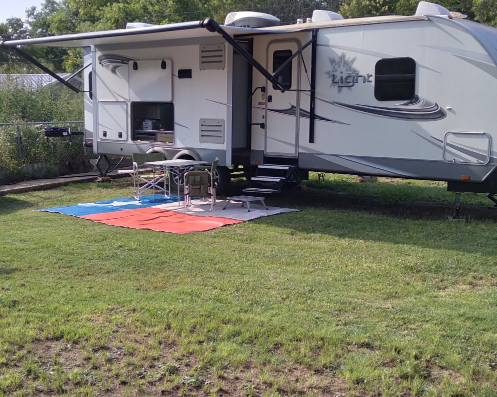 The floors out, the chairs and table in place and the grille is hooked up!