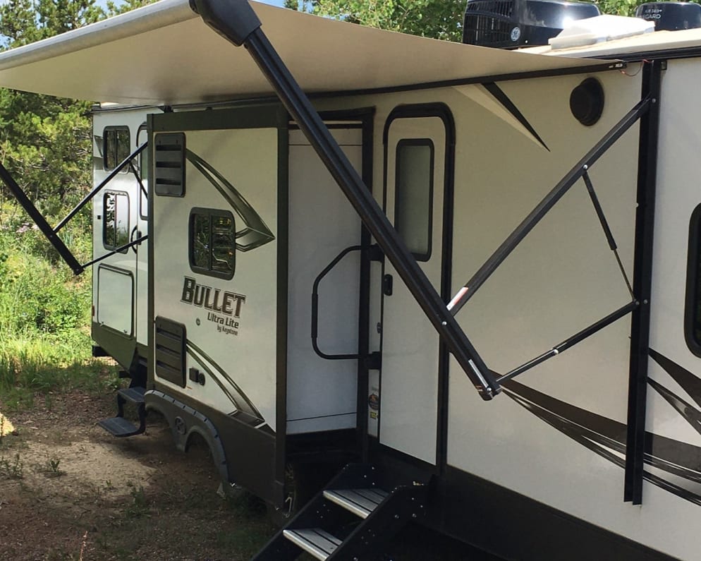 Our luxury Bullet trailer comes with two slides for added space and a 15&#39; awning with LED lights.