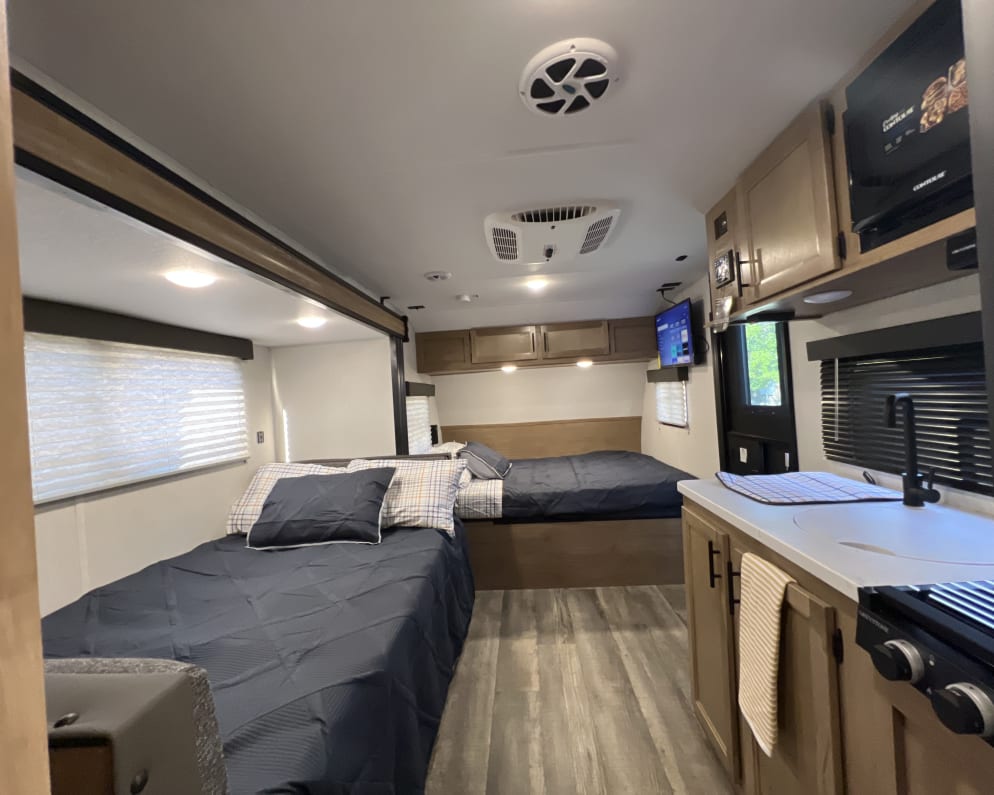 View from the back of Queen bed and converted U-Shaped Dinette