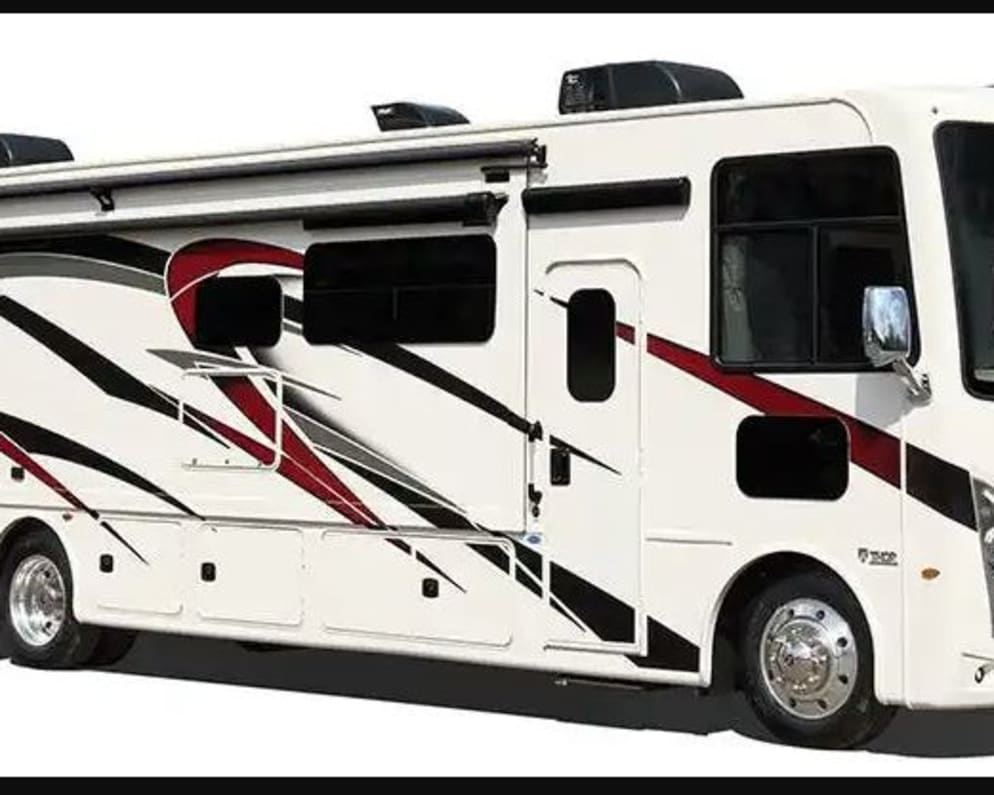 Exterior Passenger side, Perfect for family vacations, cross-country adventures, tailgating at a sporting events, NASCAR races, Formula One Races, IMSA Racing events, multi-day music festivals, corporate events, film and production crews, or just a luxurious camping trip!