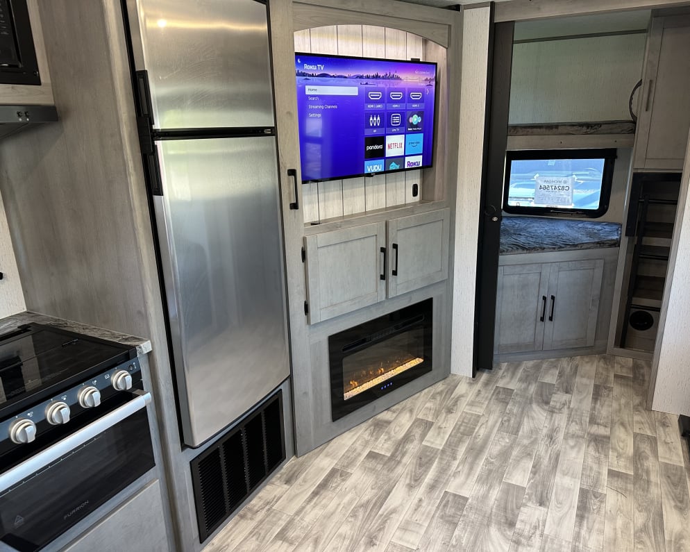 Nice large refrigerator, range with oven, 40&quot; Roku TV, and electric fireplace offer convenience and entertainment to your adventure.