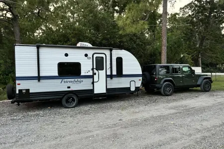 "Cozy Cruiser: Embark on Outdoor Escapes with Our Easy-Drive RV Trailer!"