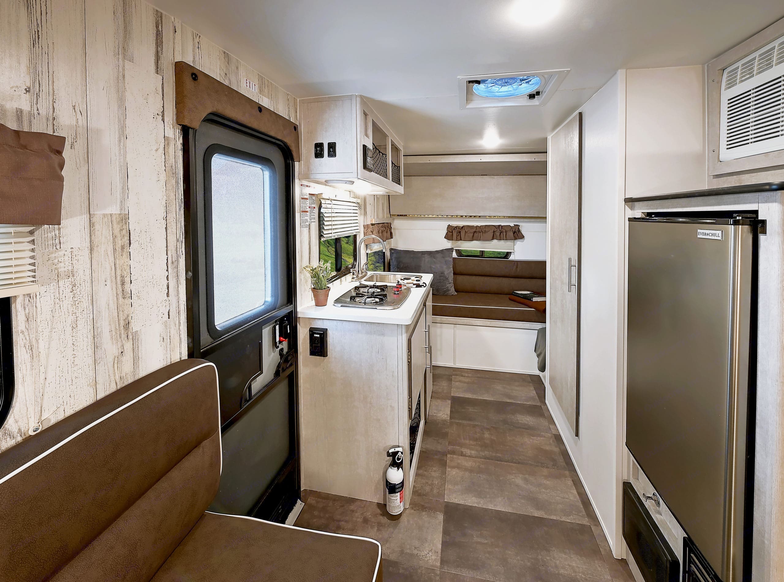 Powerful ceiling vent for air flow,  screen door and windows on all sides make for a very comfortable camper when not using the A/C. . Travel Lite Other 2021