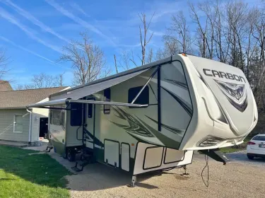 2018 Keystone RV Carbon Toy Hauler Fifth-wheel rental in Chalmers, IN