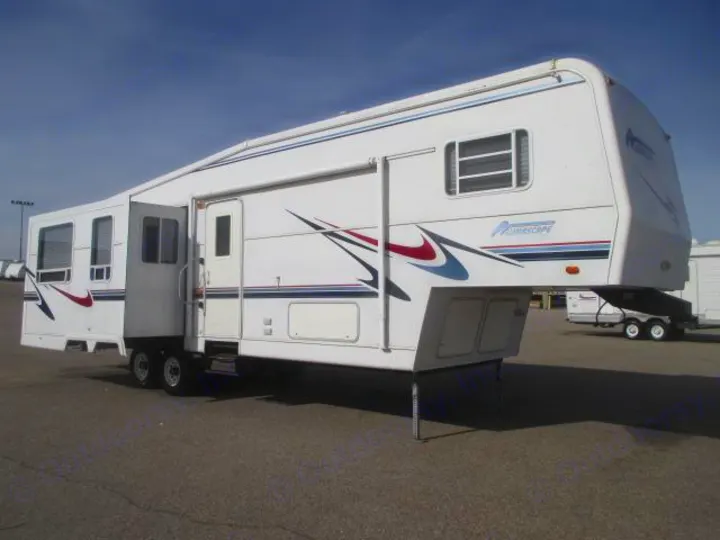 This white fifth-wheel rv rental offers spacious living with an open slide-out, perfect for travel.. Holiday Rambler Alumascape 2002