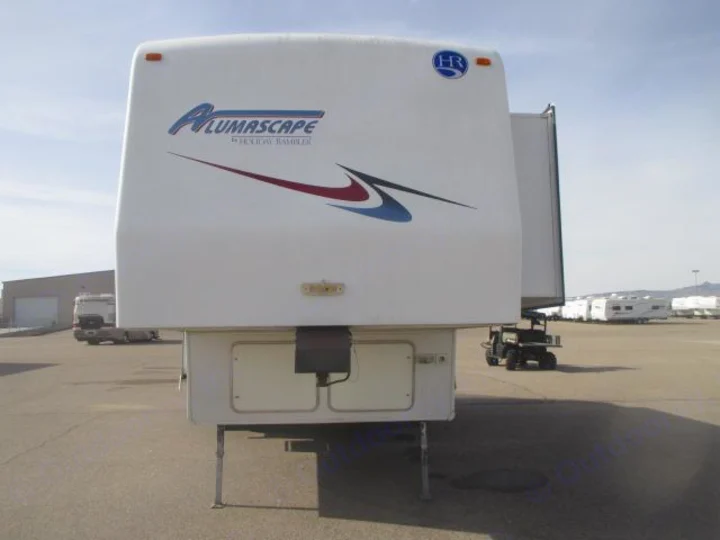 Front of a white Holiday Rambler Alumascape fifth-wheel RV, ready for your next rv rental adventure, parked in a lot.. Holiday Rambler Alumascape 2002