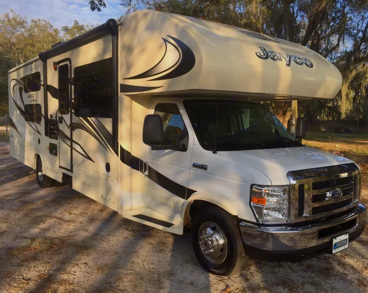 This white and beige Jayco Class C motorhome is an ideal rv rental for your next road trip adventure.. Jayco Greyhawk 2016