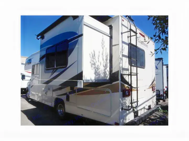 White & blue Coachmen Class C RV rental with an extended side slide-out and rear ladder.. Coachmen Freelander 2017