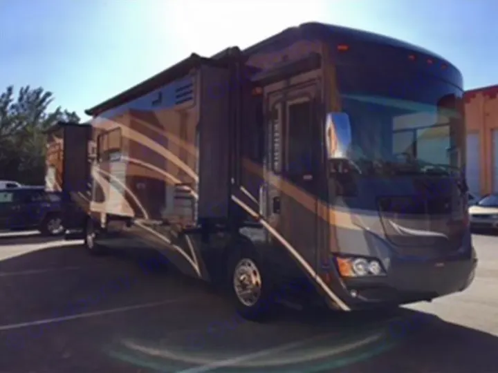 Dark brown & tan luxury motorhome for RV rental, parked outdoors with slide-outs extended, ready for adventure.. Winnebago Journey 2017
