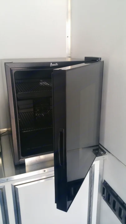 Avanti beverage cooler, door open, inside an RV rental. Ready for your trip's refreshments.. Ready 2 Roll Party Central 2021