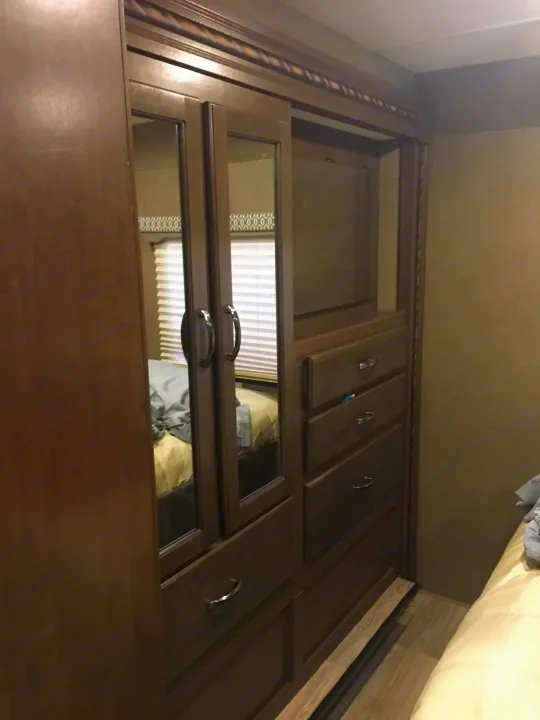 RV rental bedroom: compact wardrobe with mirrored doors and dresser. Efficient storage for your travels.. Other Other 2018