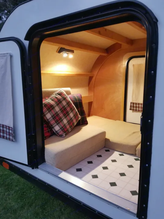 Tear drop interior with one bed out and one made into seat.. High Desert Designs Other 2004