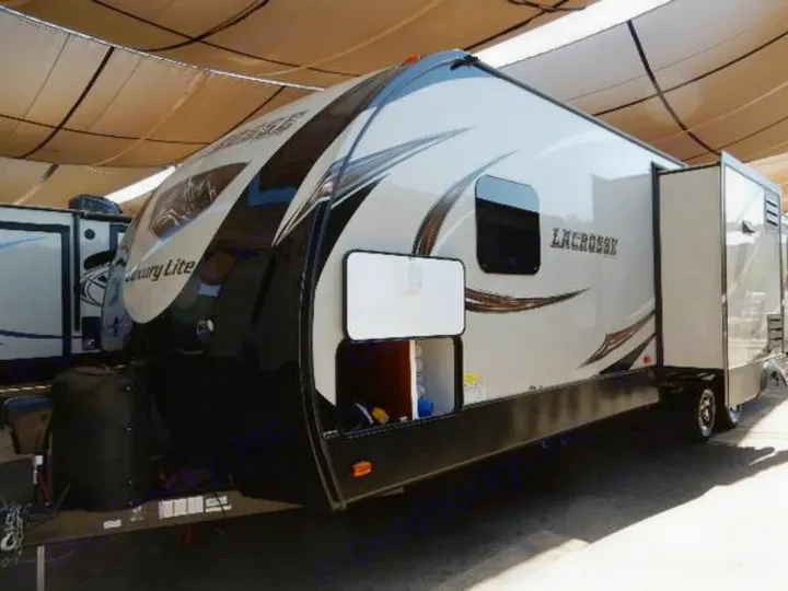 Modern two-tone LaCrosse travel trailer, ideal for your next rv rental adventure. Features an extended slide-out for space.. Prime Time Lacrosse 2017
