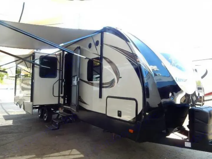 Modern luxury travel trailer for your RV rental adventure. Spacious with extended awning & steps.. Prime Time Lacrosse 2017