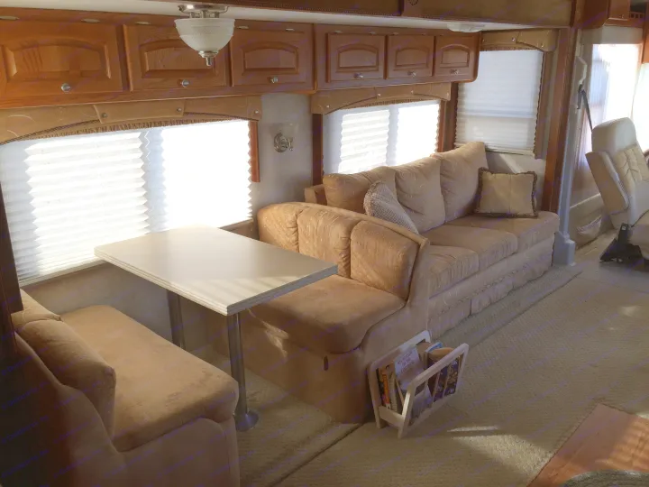 Table area converts to a small day/night bed. Damon Intruder 2005