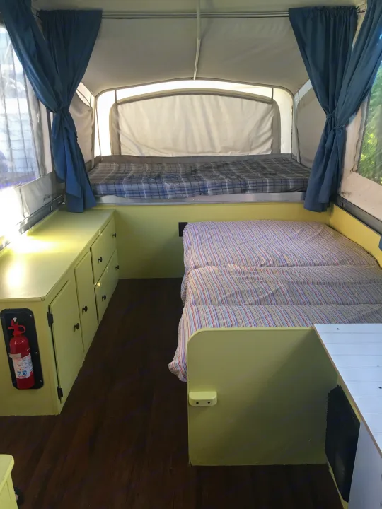 Table and seats folds out to full size bed. . Coleman Destiny Santa Fe 1996