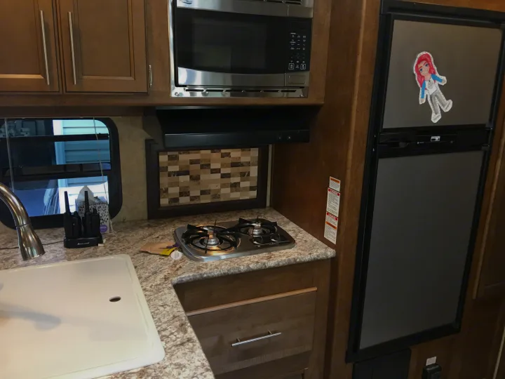 Full kitchen with double sink. Microways works on generator if boondocking. . Prime Time Fury 2910 2016