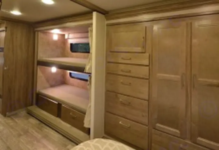 Experience family comfort in this RV rental! Features include bunk beds with windows and lights, and extensive wood storage units.. Jayco Envoy 31L 2018