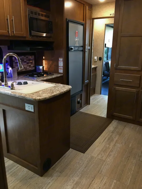 Very clean and functional kitchen. Remember, this is a Toy Hauler designed for boon docking so it has large water and waste tanks!. Prime Time Fury 2910 2016