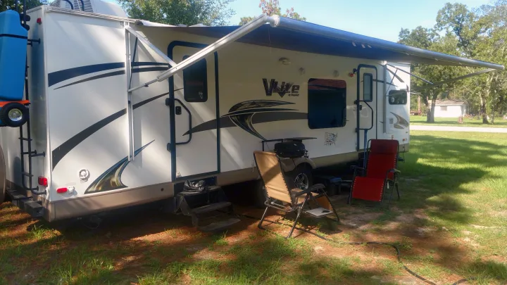 Set up in the bright sun.  The 21 foot awning cools things down. Forest River V-Lite 2015