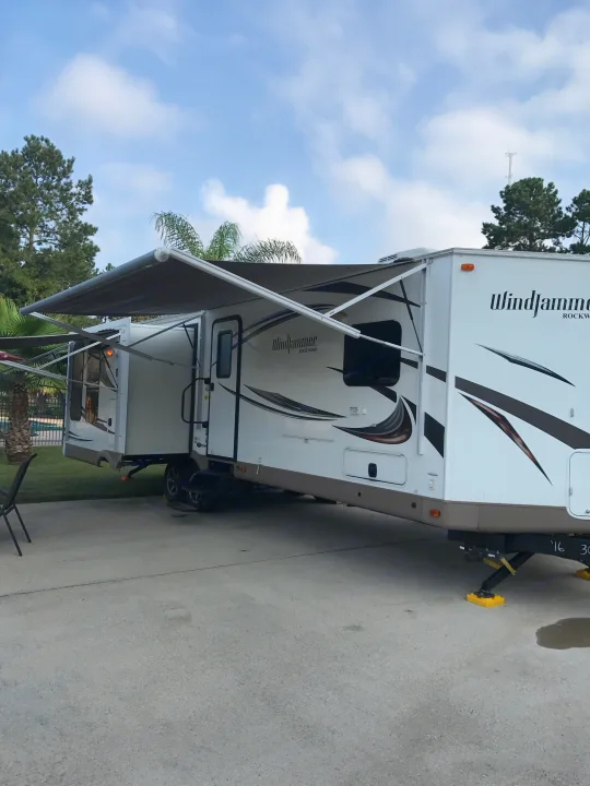 Outside from the front with awning out. Forest River Rockwood Windjammer 2016