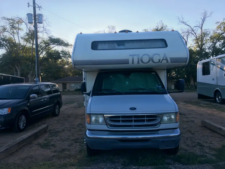 This is the front of the RV, where whoever is sleeping up above the van can see out of the window.  . Ford tioga 1998
