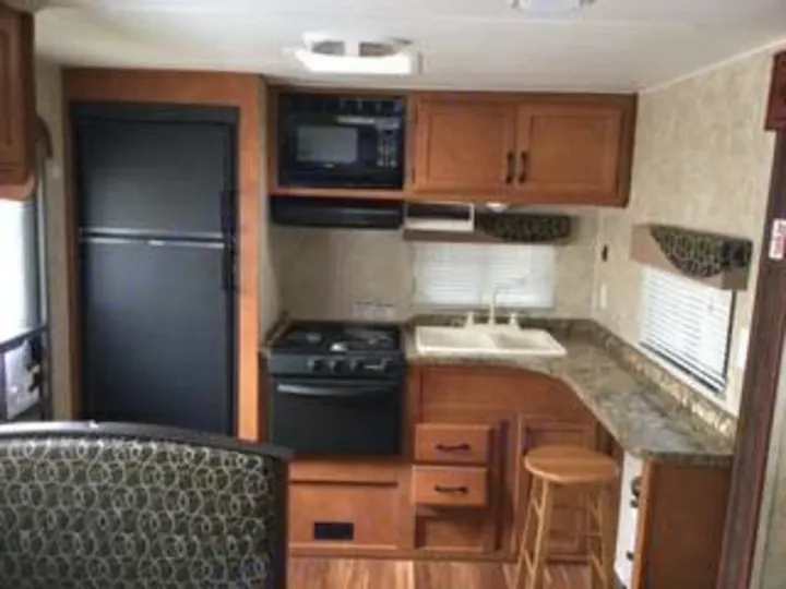 The unique rear kitchen design gives plenty of space for preparing meals.. Aerolite Travel Trailer 2014